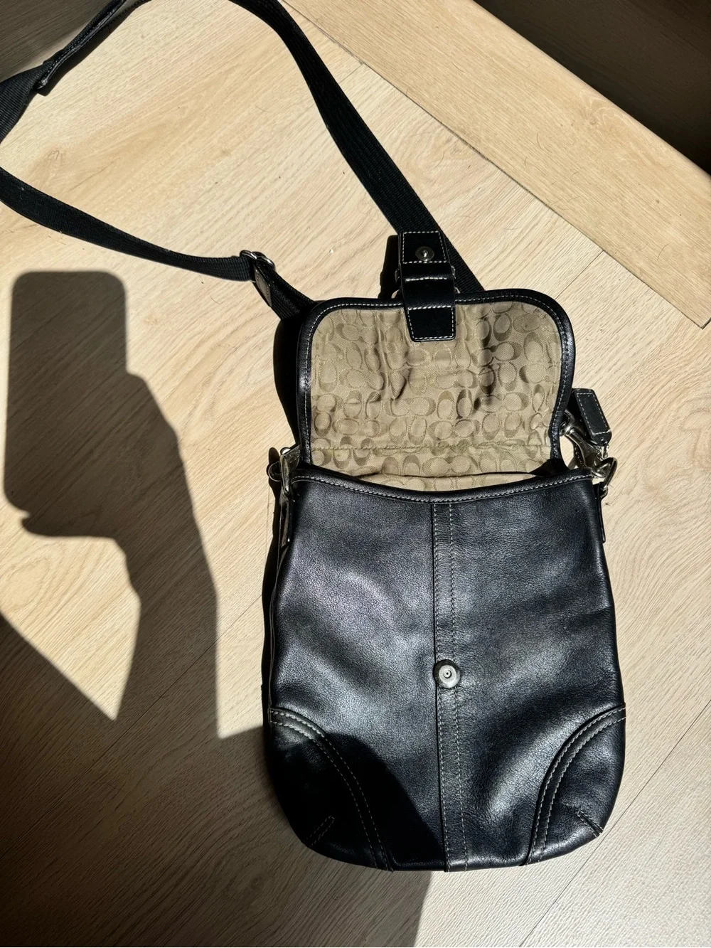 Black Coach Leather Crossbody Bag with Buckle Detail